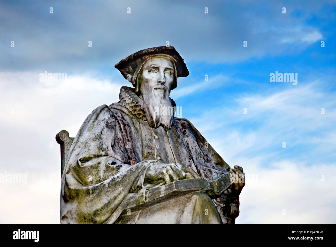 A stone statue of Richard Hooker, situated on the green beside Exeter Cathedral, Devon, UK. Stock Photo