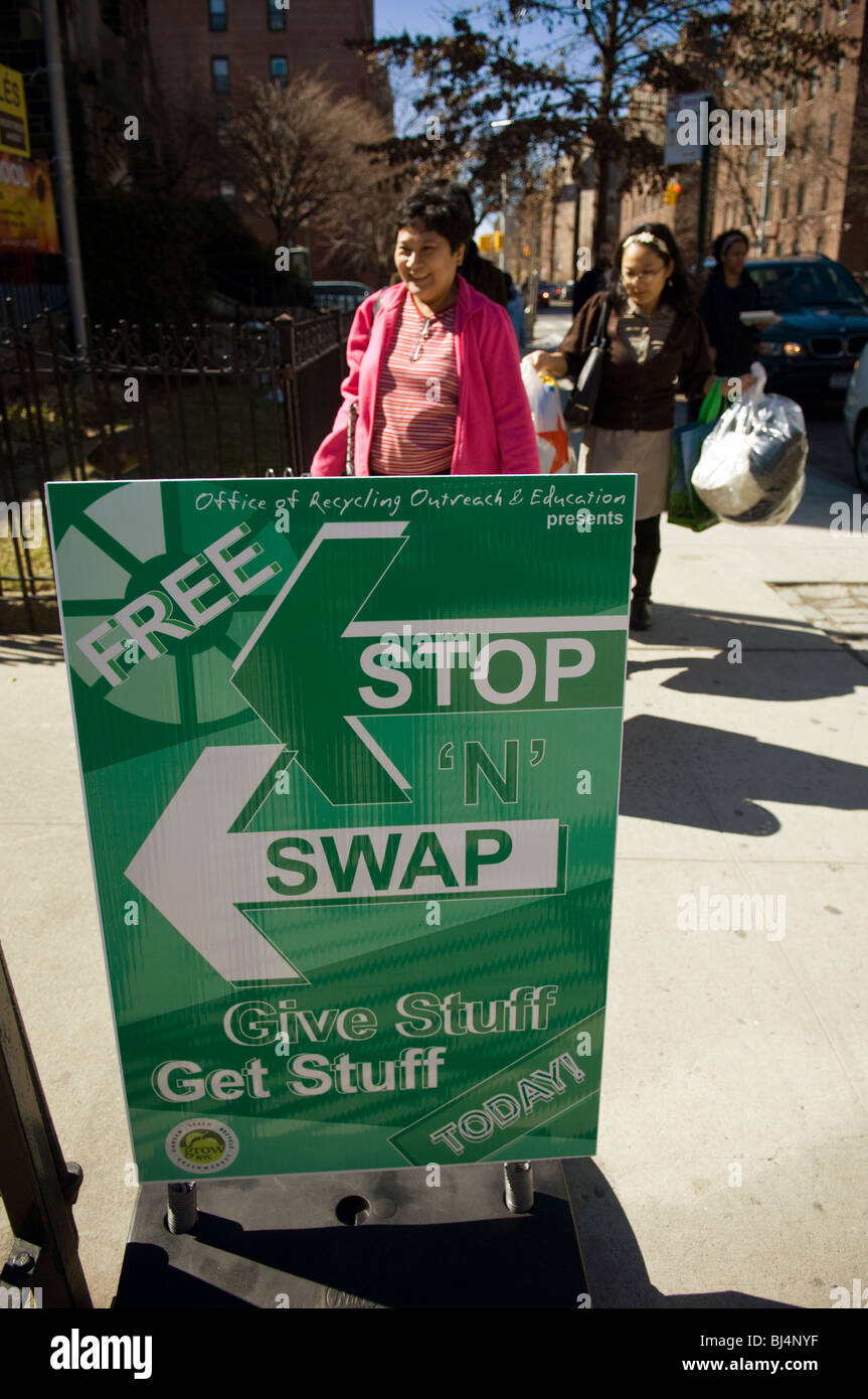 Thrifty shoppers bring unwanted belongings to a free Stop 'N' Swap event in the Jackson Heights neighborhood of Queens in NY Stock Photo