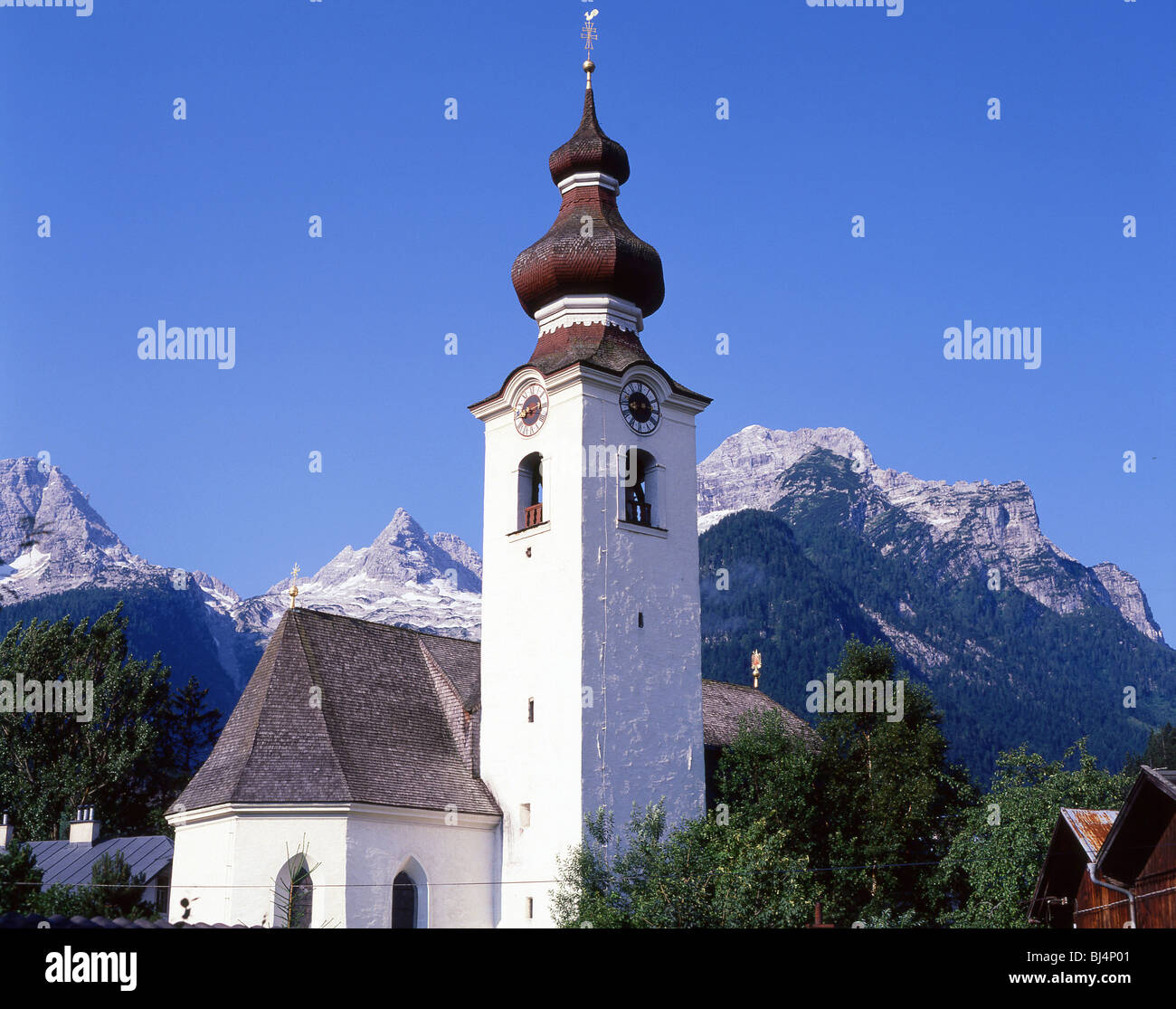 Our Lady of the Rosary Church and mountains, Lofer, Salzburg State, Republic of Austria Stock Photo