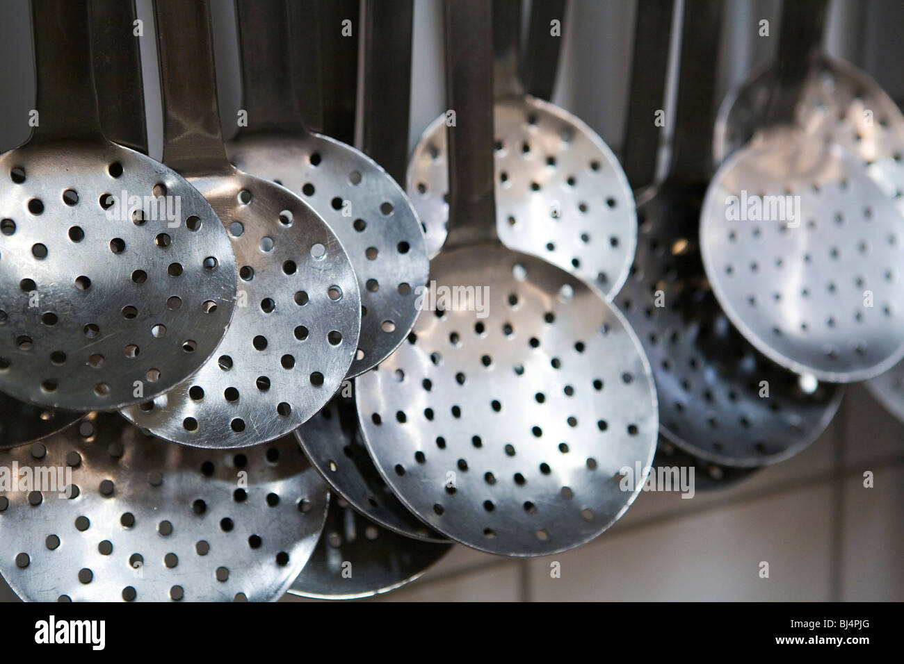 Skimming ladles in a commercial kitchen Stock Photo Alamy