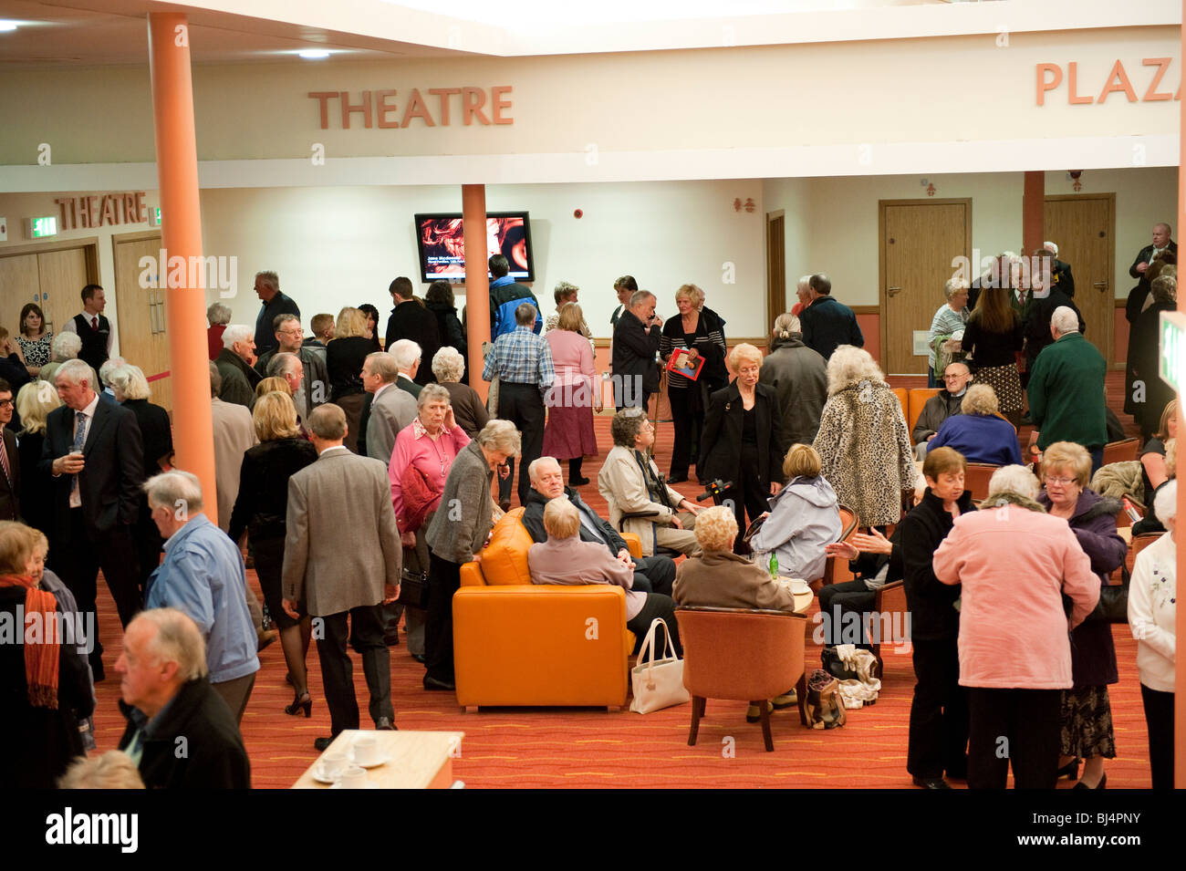 Floral Pavilion theatre foyer with crowds of patrons Stock Photo