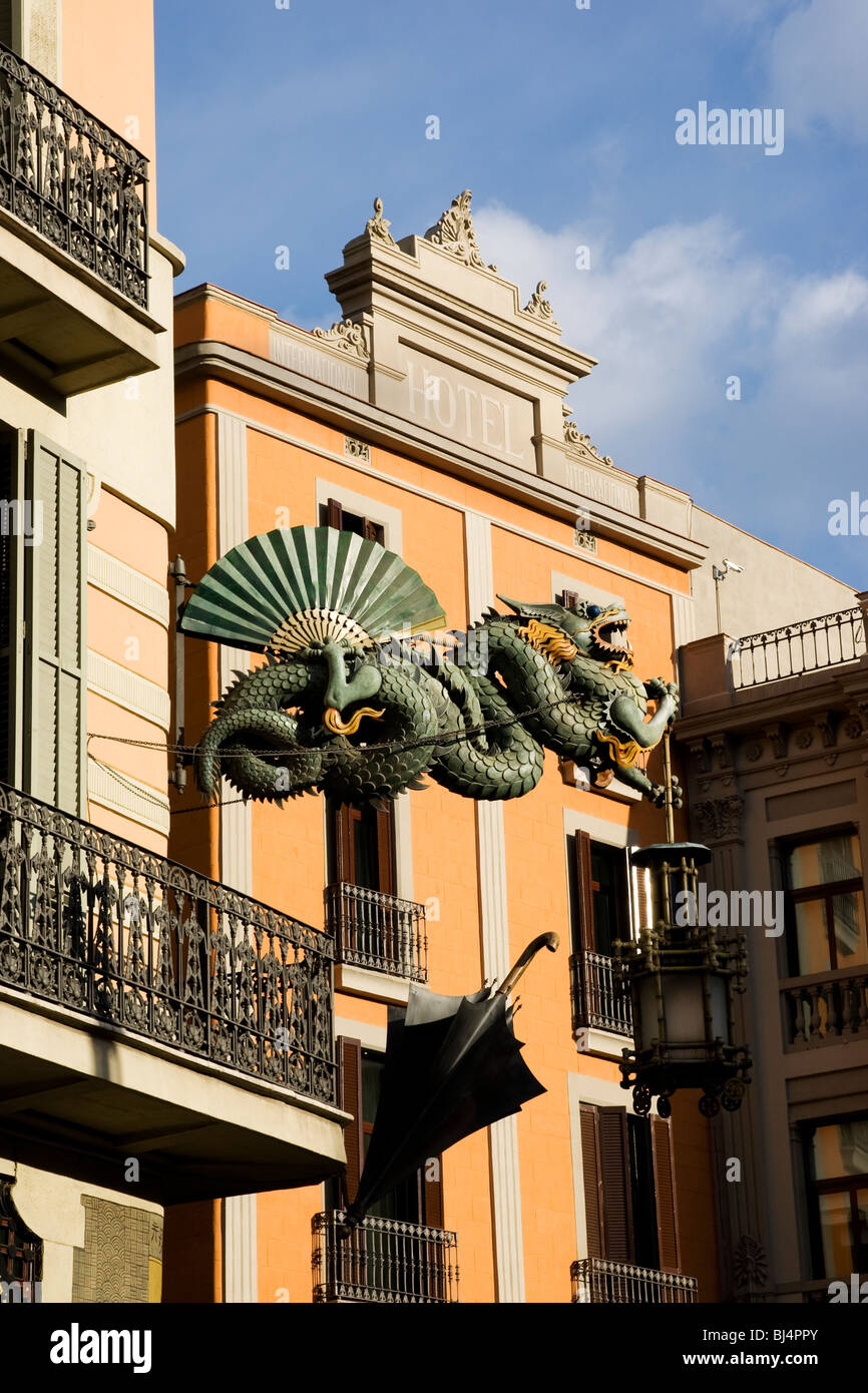 Green cast iron Chinese dragon umbrella and lamp at the site of a former umbrella shop at Las Ramblas in Barcelona in Spain Stock Photo