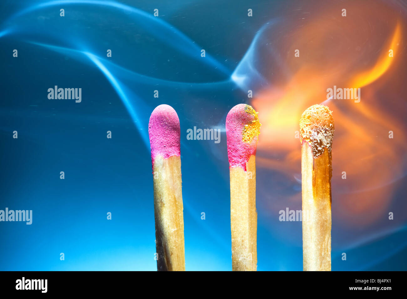 Three burning matches macro. Stock Photo