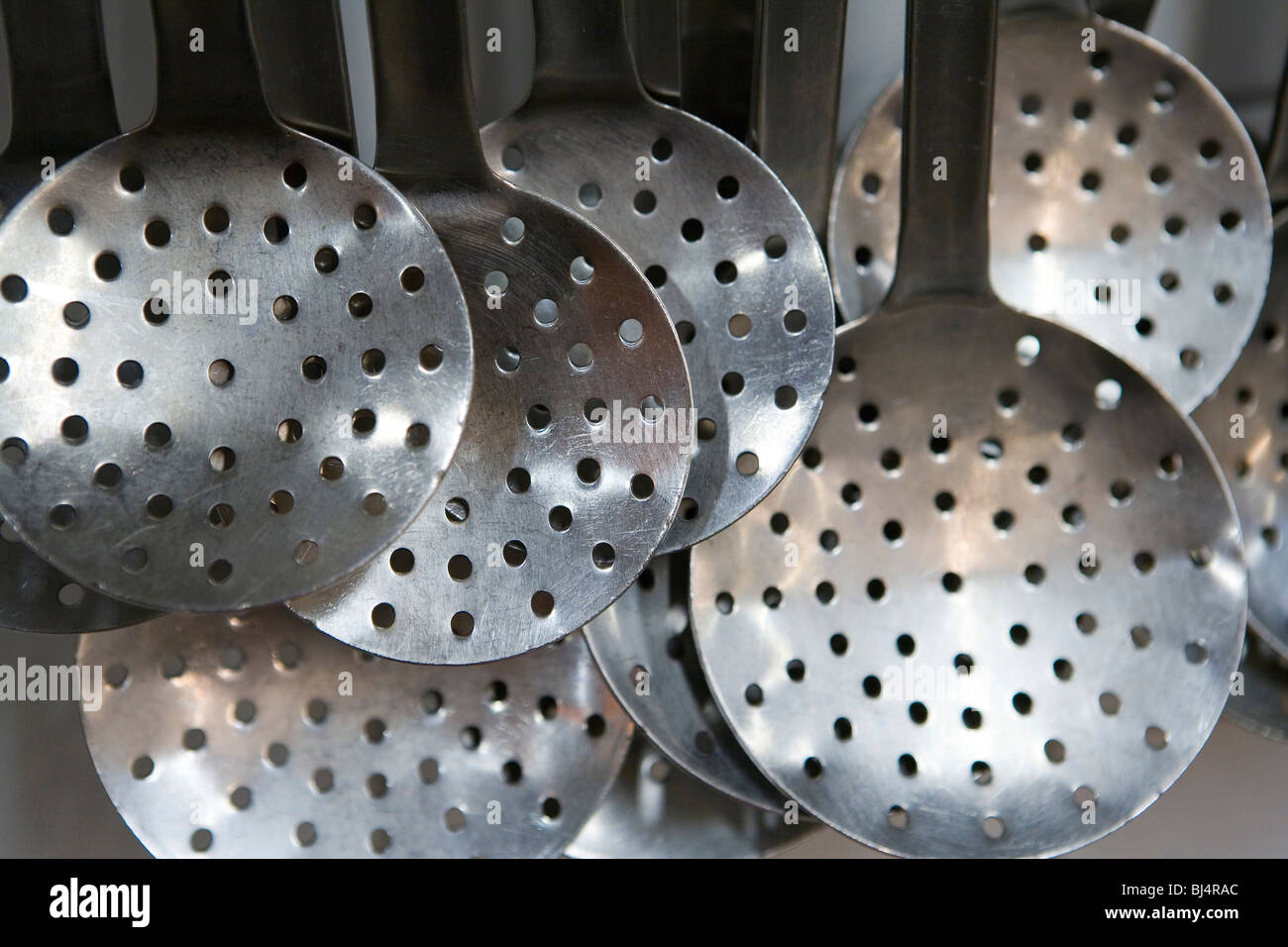 Skimming ladles in a commercial kitchen Stock Photo Alamy