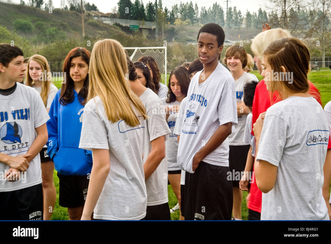 Uniformed interrracial middle school students turn out for physical education class outdoors in Aliso Viejo, California. Stock Photo
