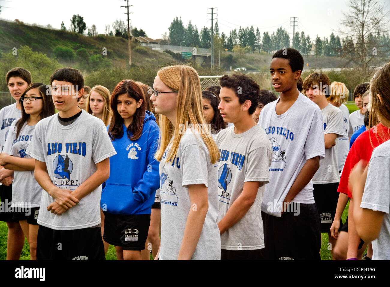 Uniformed interrracial middle school students turn out for physical education class outdoors in Aliso Viejo, California. Stock Photo