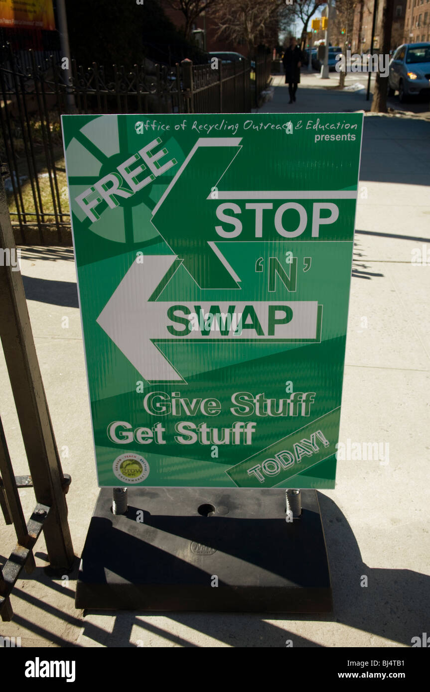 Thrifty shoppers bring unwanted belongings to a free Stop 'N' Swap event in the Jackson Heights neighborhood of Queens in NY Stock Photo
