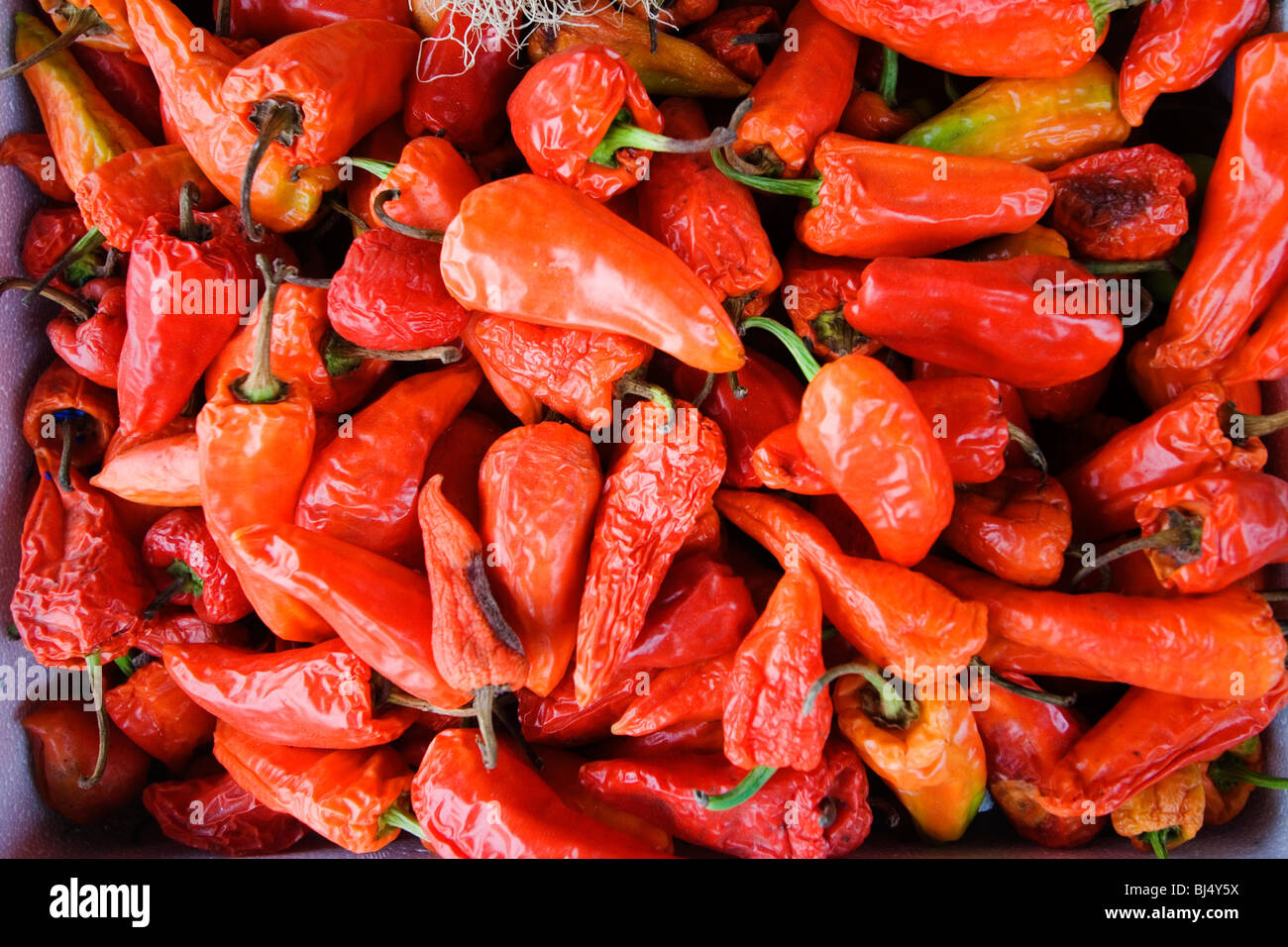 Pile of red chili peppers at a market Stock Photo - Alamy
