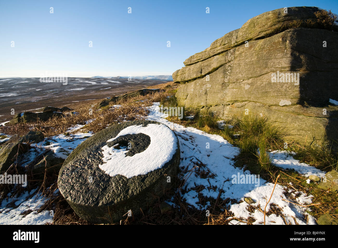 Abandoned millstone below Stanage Edge, Peak District, Derbyshire, UK Stock Photo