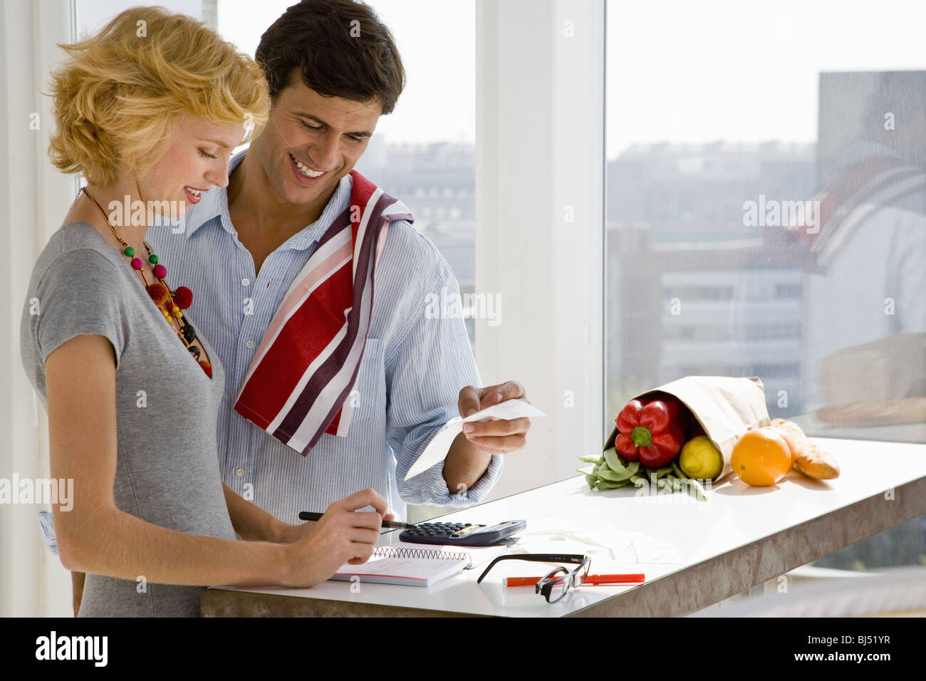 Couple reviewing paperwork home hi-res stock photography and images - Alamy