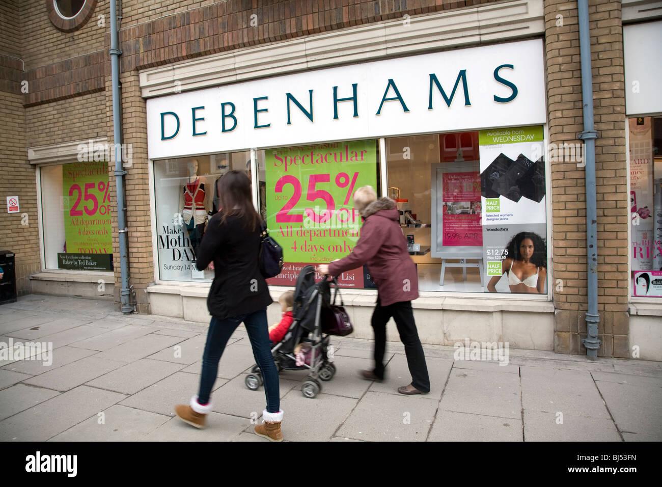 Debenhams shop exterior with shoppers looking in window Stock Photo