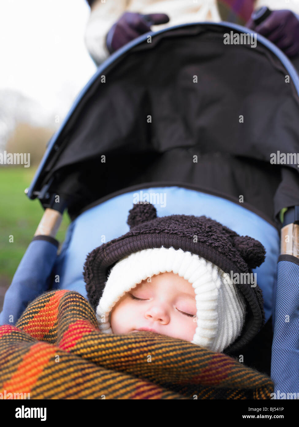 Baby Sleeping In Stroller High Resolution Stock Photography and Images