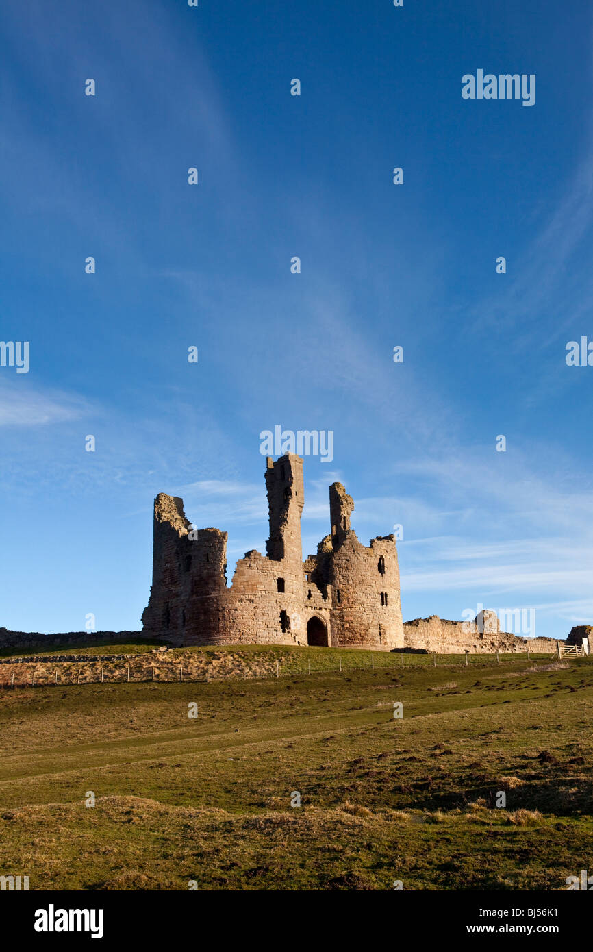 Dunstanburgh Castle remains on the Northumberland Coast Stock Photo