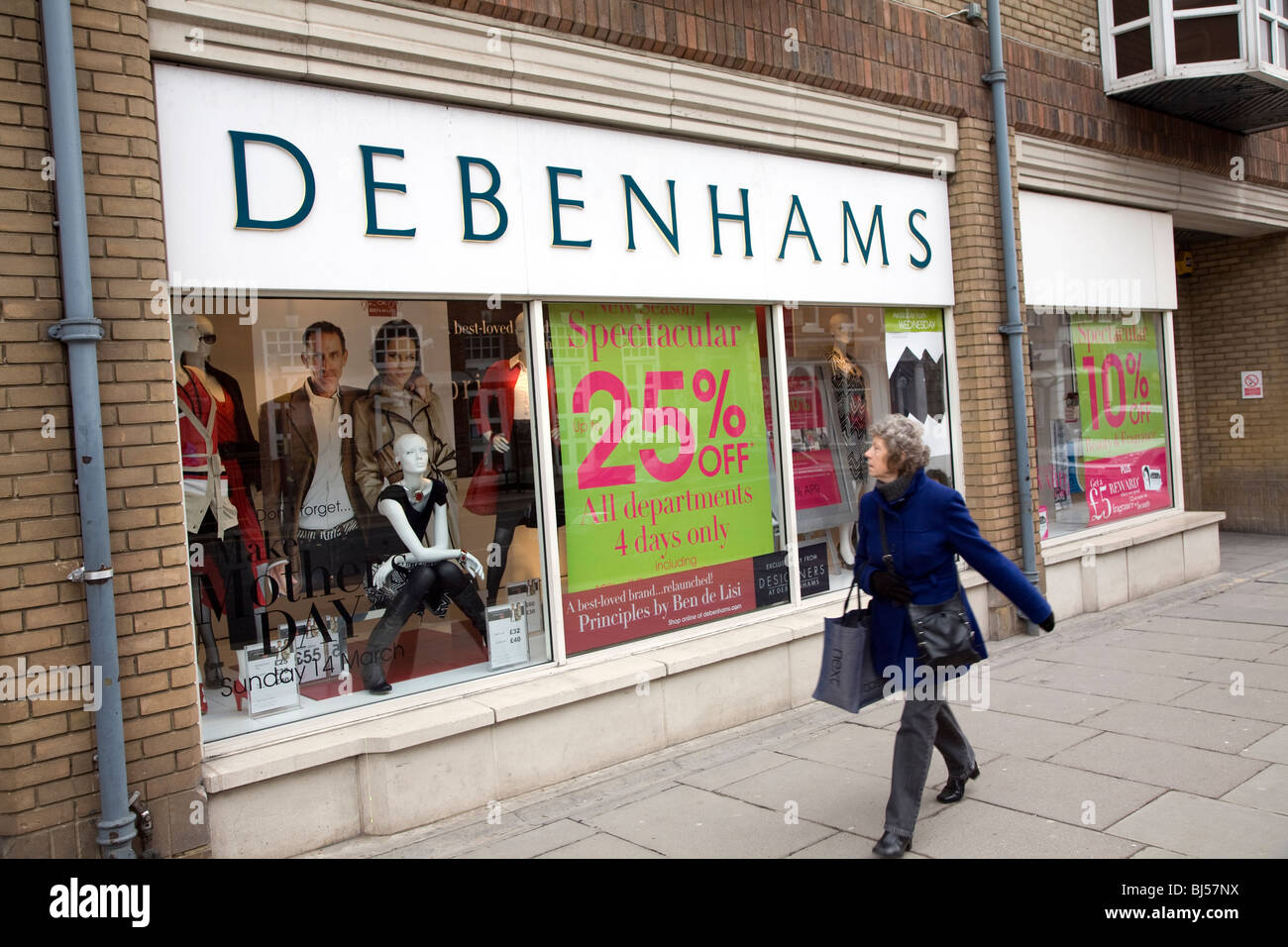 Debenhams shop exterior with woman shopper looking in window Stock Photo