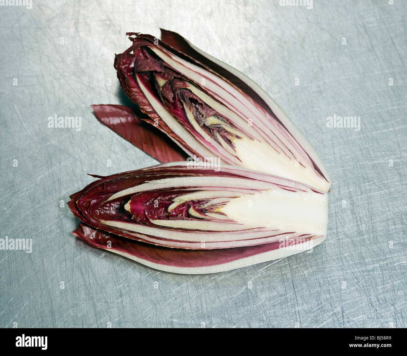 A small red cabbage cut in two pieces Stock Photo