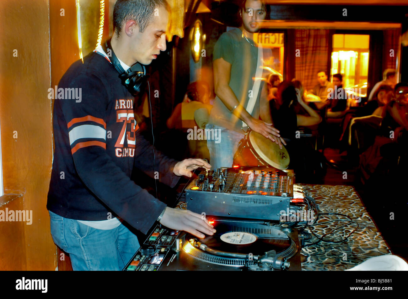 PARIS, France, Young Male D.J. Spinning in African Theme Bar Restaurant 'L'Impala Lounge' Stock Photo