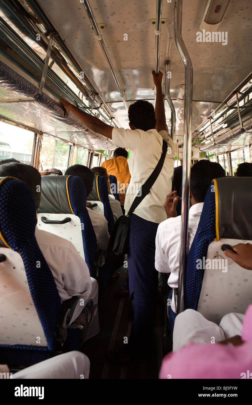 India, Kerala, Calicut, Kozhikode, transport, passengers standing inside local bus Stock Photo
