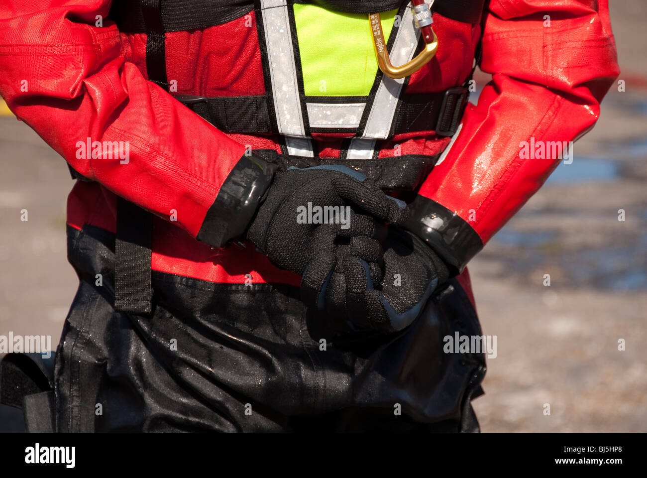 Fireman in water rescue gear with hands clasped FULLY MODEL RELEASED