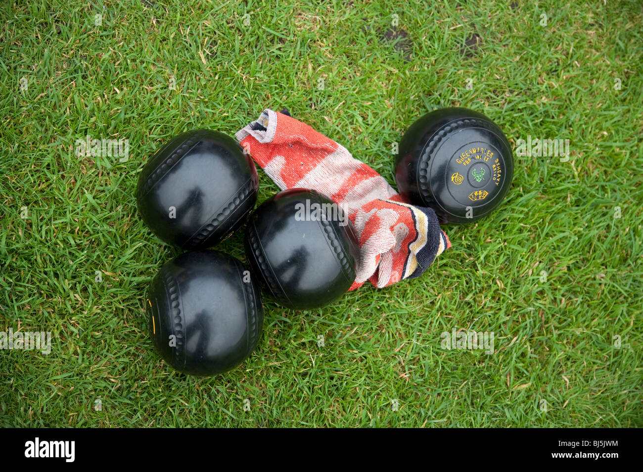Crown green bowling balls bowls and cloth on grass Stock Photo