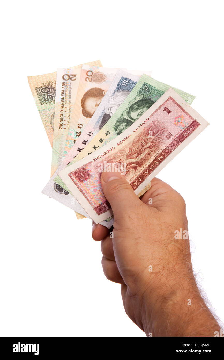 Money male hand holding handful of Chinese currency Stock Photo