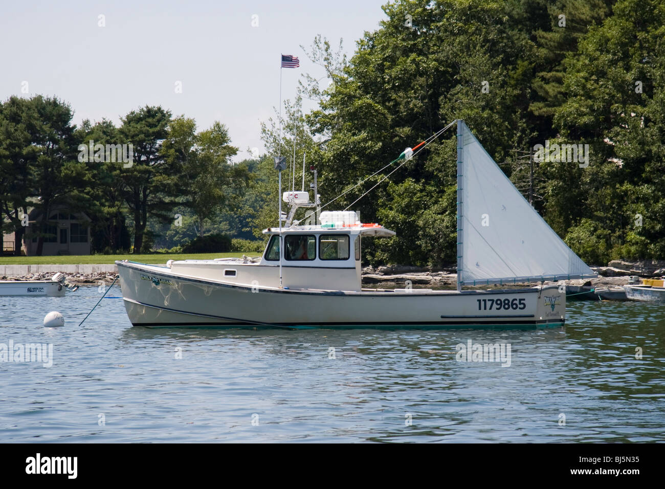 Lobster Boat With a steadying Sail in Quahog Bay Stock Photo Alamy