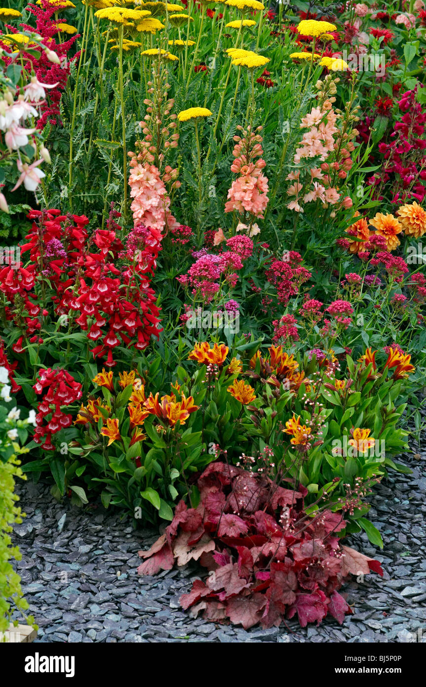 Colourful garden border with a wonderful display of herbaceous and perennial plants Stock Photo