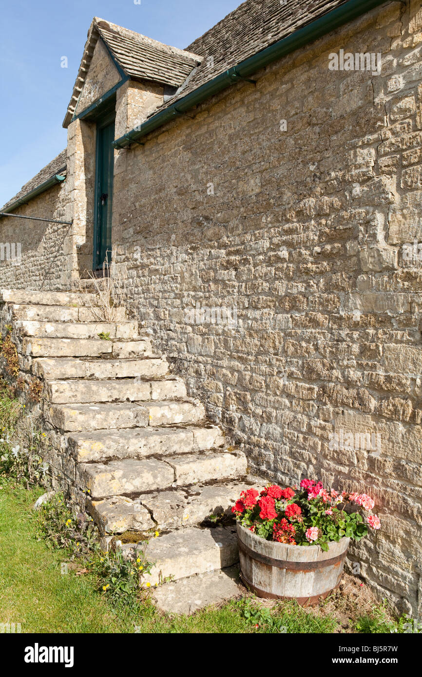 External steps on a stone barn in the Cotswold village of Yanworth, Gloucestershire Stock Photo