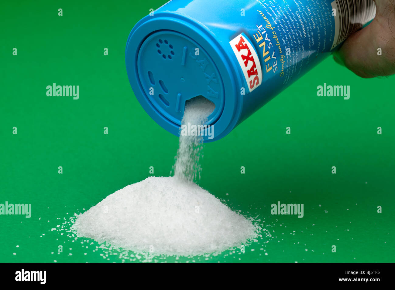 Saxa Fine ground sea salt pouring from a container Stock Photo