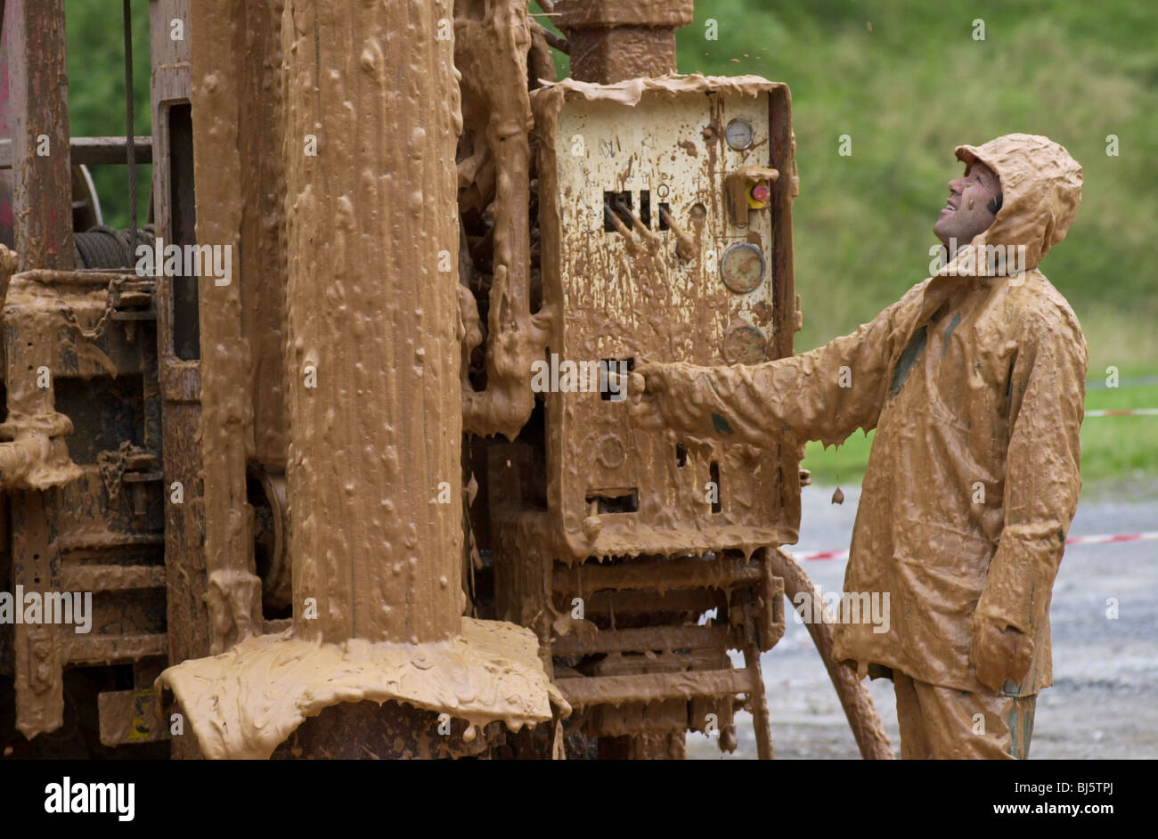 Engineer covered in foam and mud while drilling for water at Gwalia Whisky Distillery Penderyn