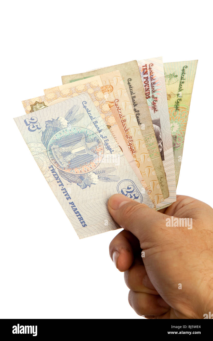 Money male hands holding handful of Egyptian currency Stock Photo