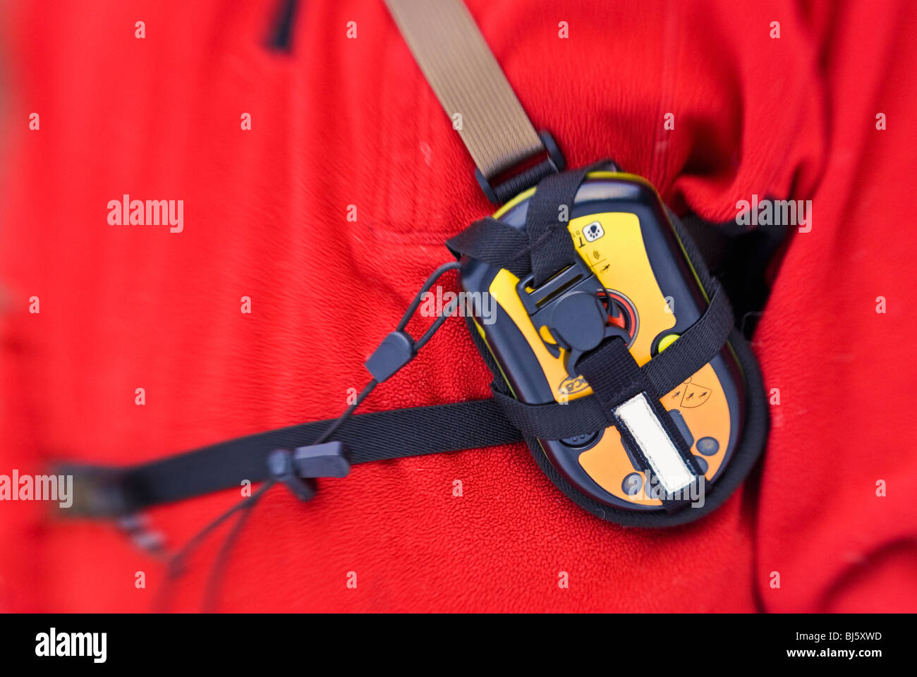 Detail of an avalanche beacon properly worn on a skiers chest, Sequoia