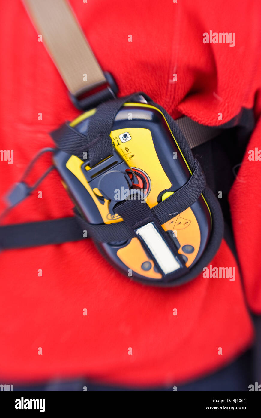 Detail of an avalanche beacon properly worn on a skiers chest, Sequoia