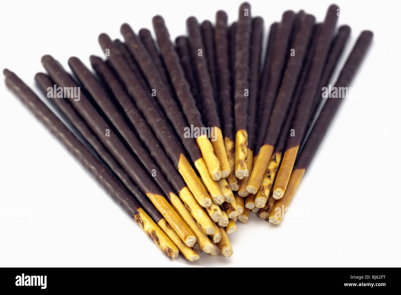 Pile of biscuit sticks dipped in dark chocolate Stock Photo