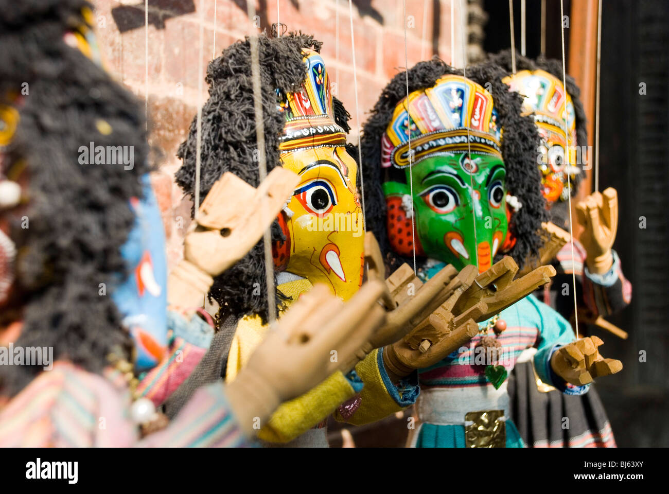 A row of wooden puppets on sale, Bhaktapur, Nepal. Stock Photo