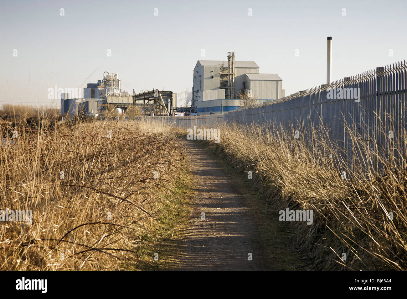 Pathway and factory in Lancashire,UK Stock Photo