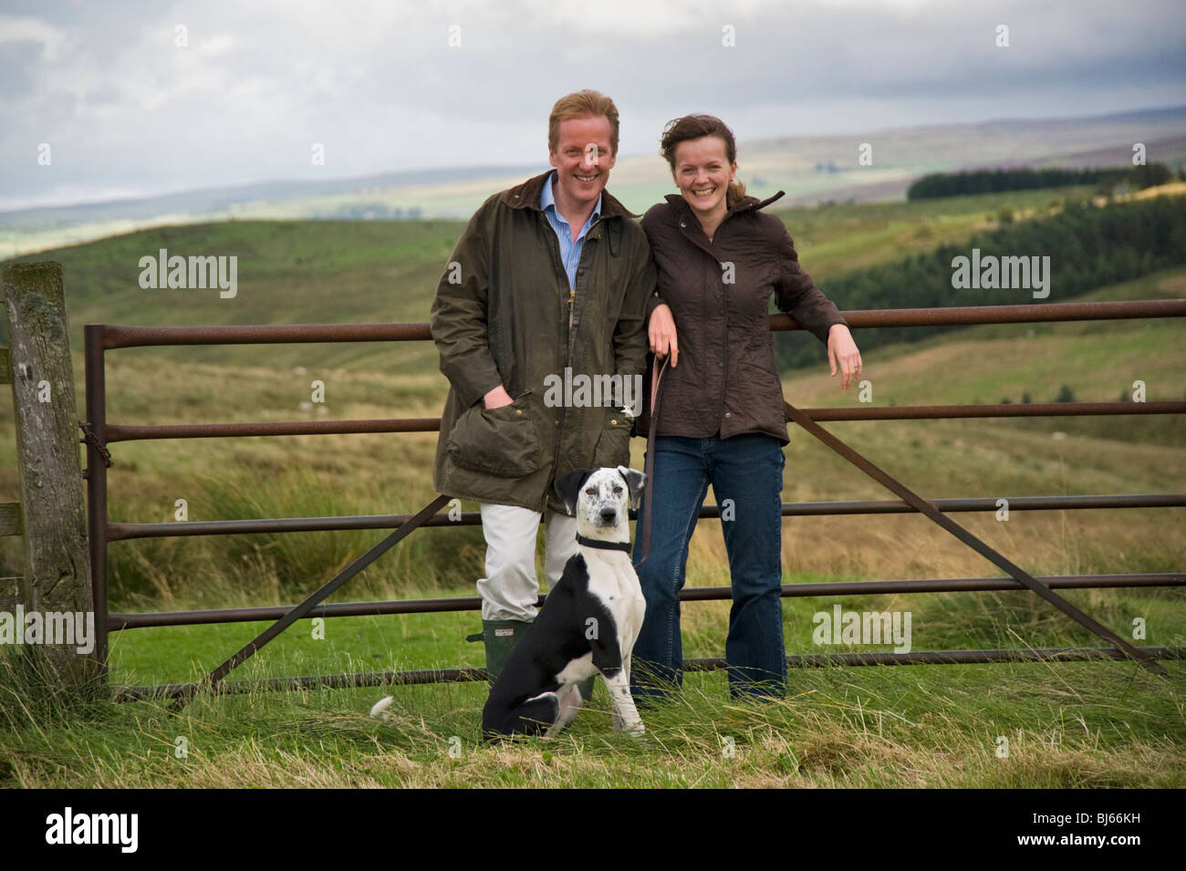 Married couple with pet dog enjoying their country lifestyle, Cumbria, uk Stock Photo