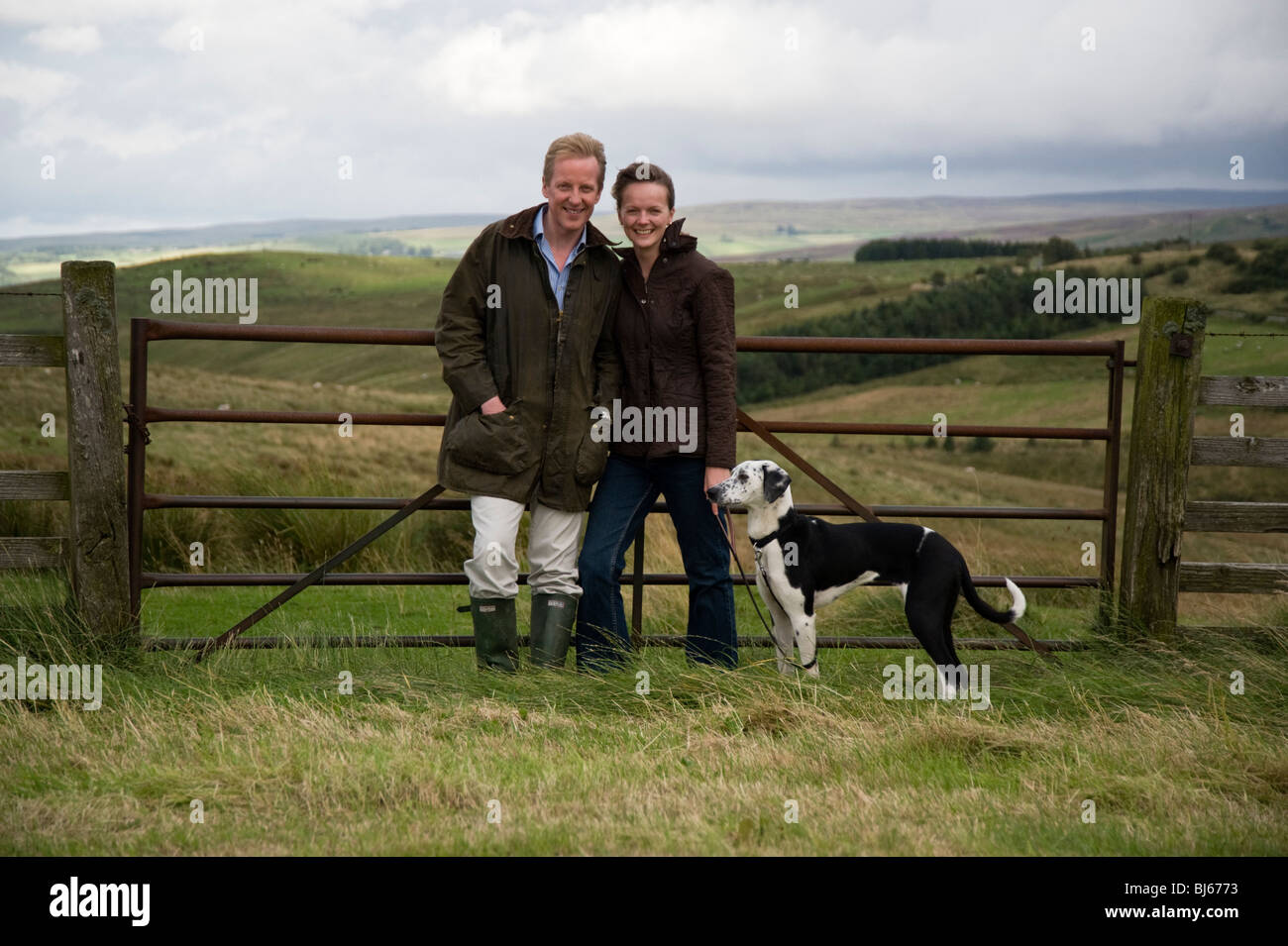 Married couple with pet dog enjoying their country lifestyle, Cumbria, uk Stock Photo