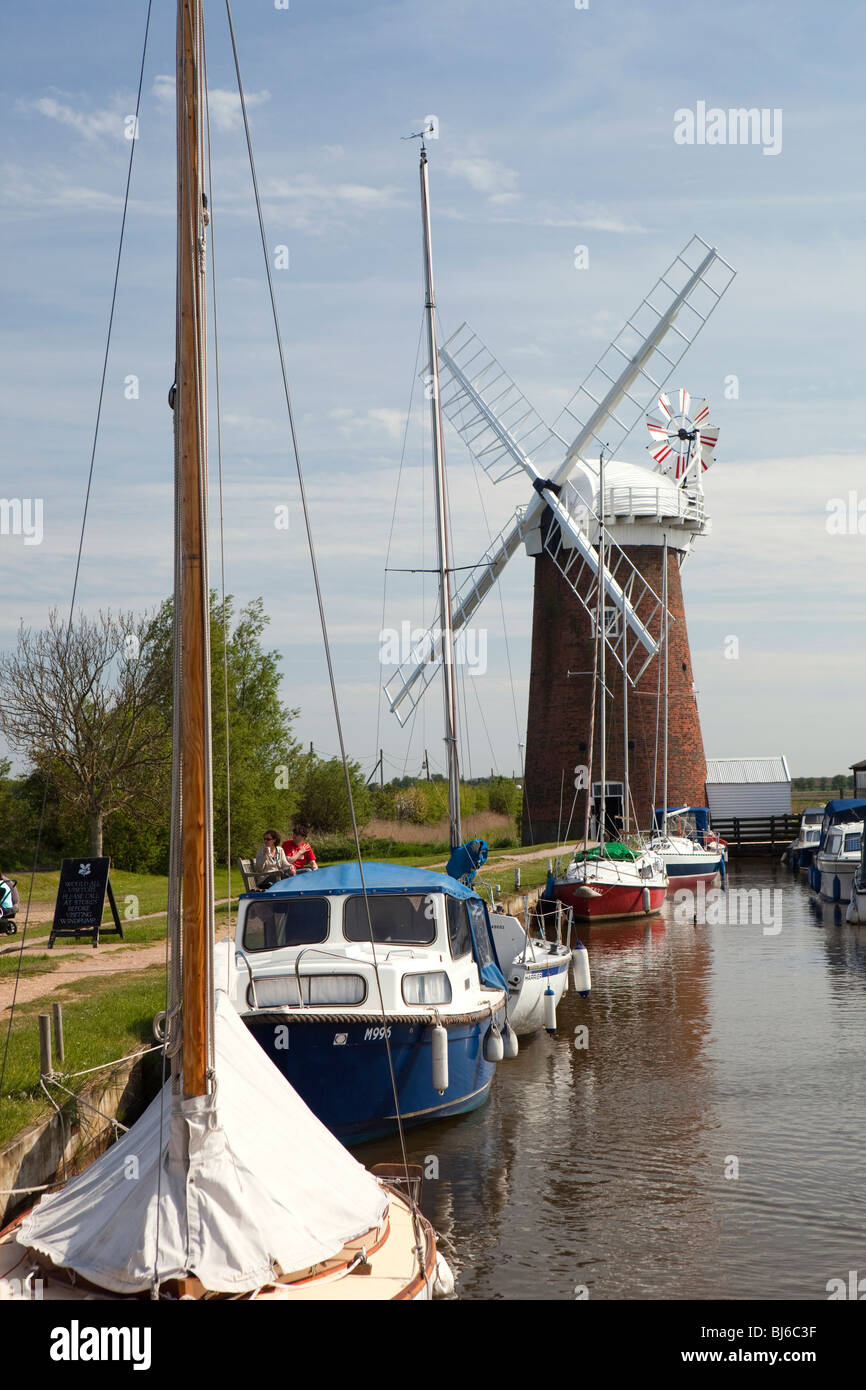 UK, England, Norfolk, Horsey windpump, boats moored on the mere Stock Photo