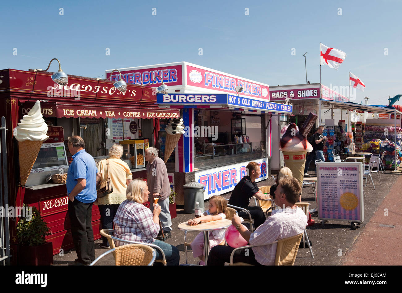 UK, England, Norfolk, Hemsby, Beach Road, customers at fast food outlets on sunny day Stock Photo