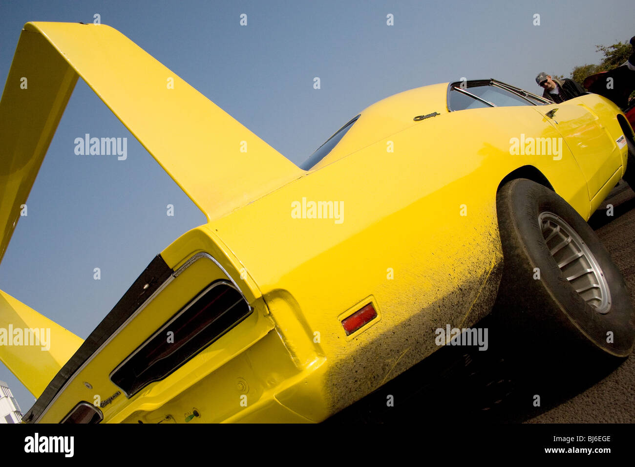Bright yellow American muscle car at Goodwood Stock Photo Alamy