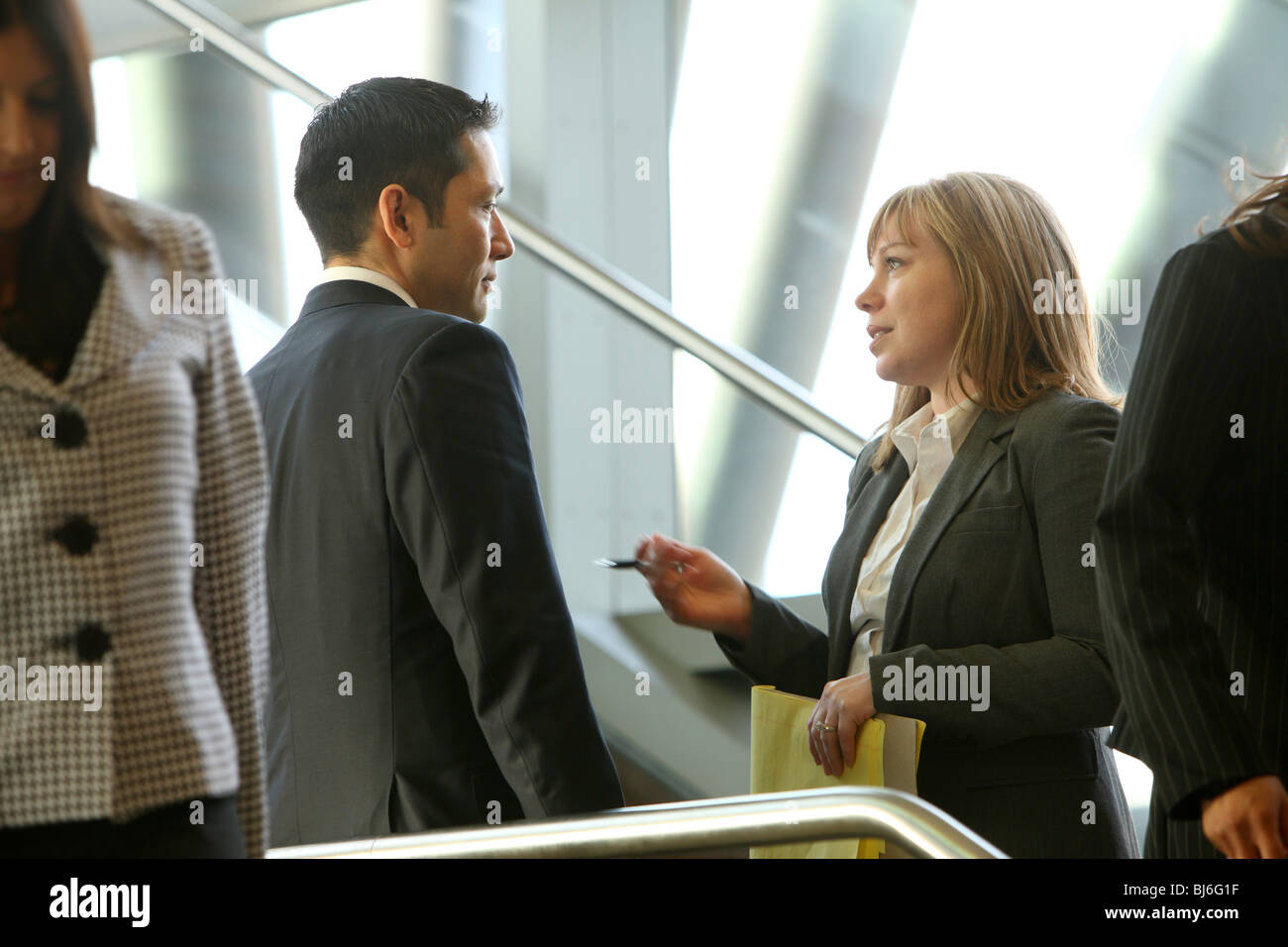 Businesspeople meeting on steps Stock Photo