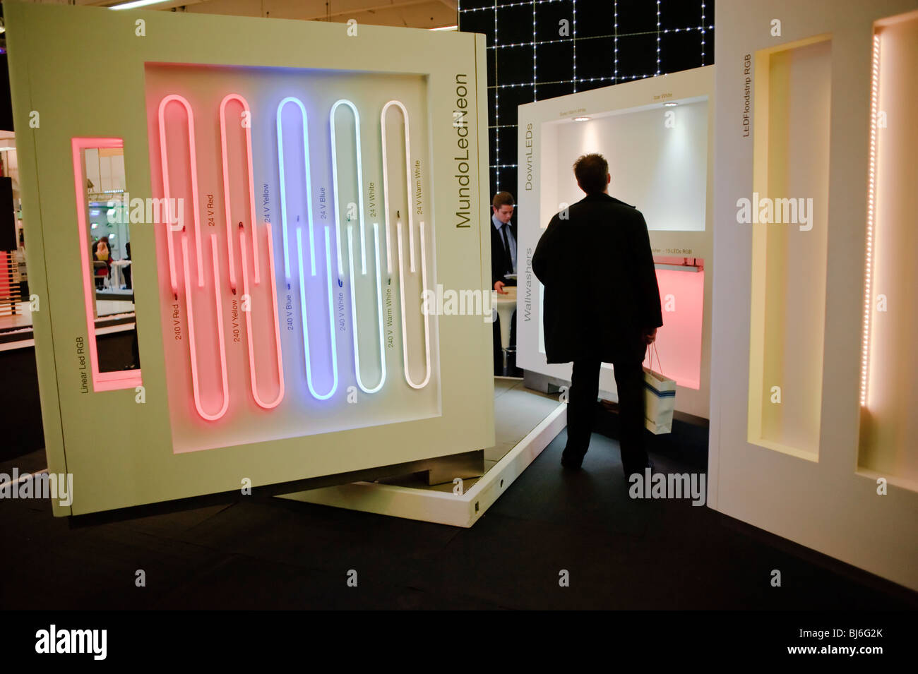 Paris, France, Man Visiting, Walking away, Construction Equipment Trade Show, LED Lighting Company Display, Foire Exposition Stock Photo