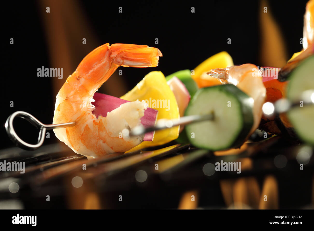 Shrimp and vegetable skewer on grill closeup Stock Photo
