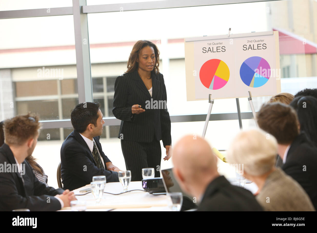 Business woman giving presentation Stock Photo