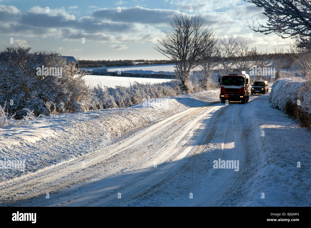 Vehicles on a snow covered road in North Yorkshire in the United Kingdom Stock Photo