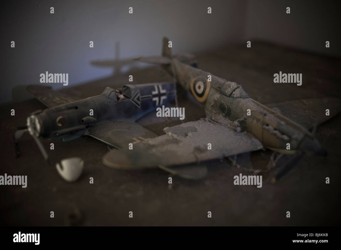 Scale models of a Spitfire and Messerschmidt 109 covered in dust and forgotten Stock Photo