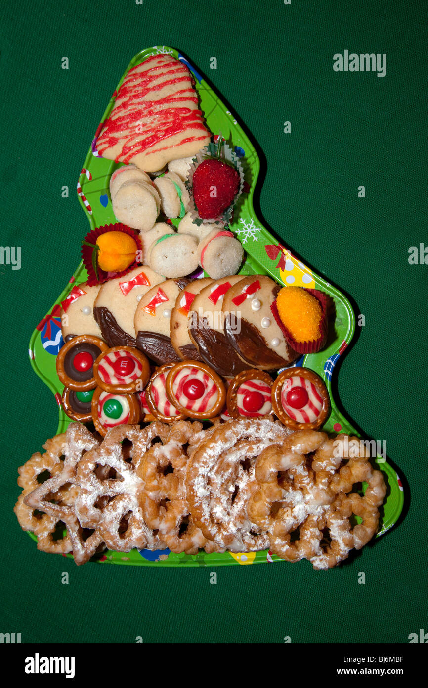 Christmas tree tray holding an arrangement of fancy decorated holiday