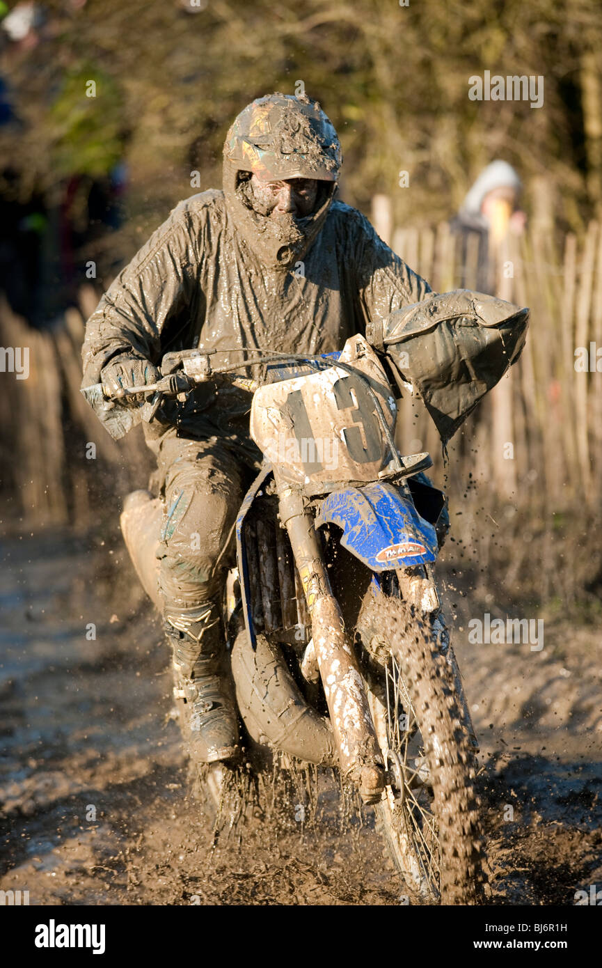 Motocross bike rider covered in mud Stock Photo - Alamy