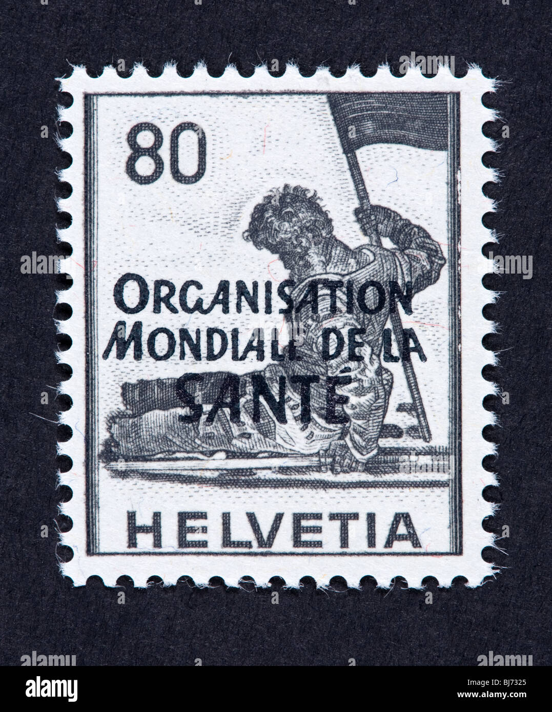 Postage stamp of Switzerland overprinted for use by the World Health Organization, depicting a dying warrior. Stock Photo
