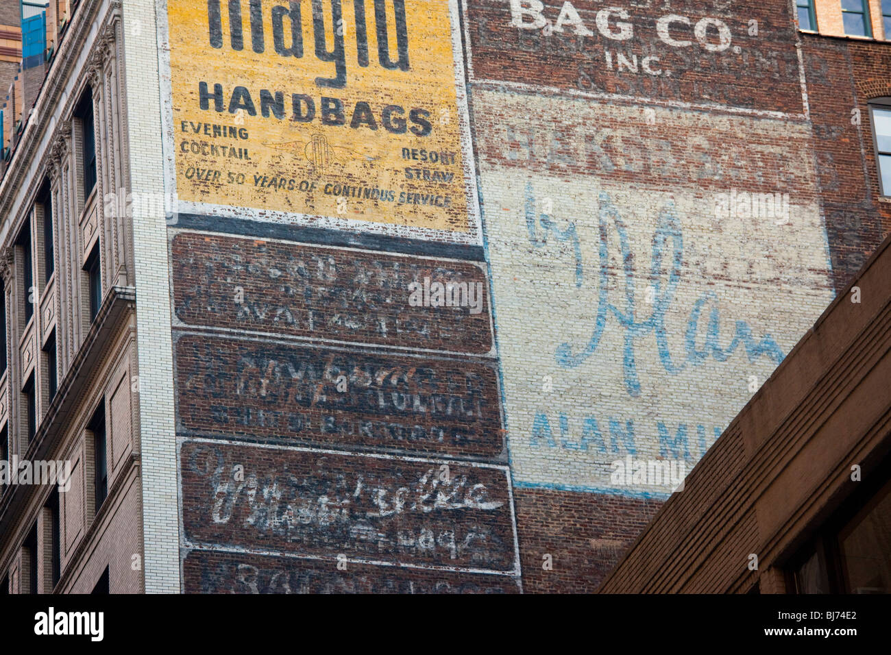 Faded adverising on a building in midtown Manhattan, New York City Stock Photo